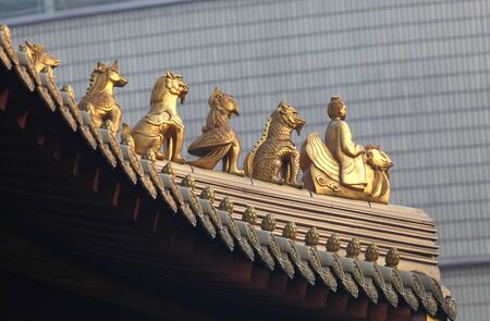 Decoration on the roof of Jing'an temple in Shanghai, Chinaの写真素材