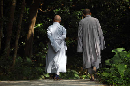 Buddhist monks walking in Tian Tan Monastery. Photo taken at 1st of December 2010のeditorial素材