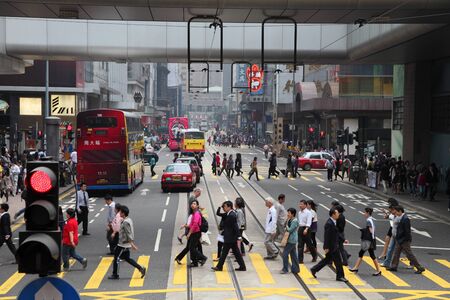 Pedestrians walking over the street in Hong Kong. Photo taken at 30th of November 2010のeditorial素材