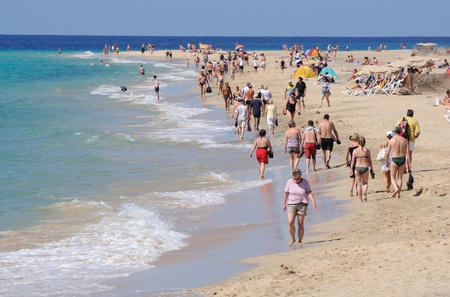 People walking on the beach Jandia Playa, Fuerteventura, Spain. Photo taken at 31th of May 2009のeditorial素材