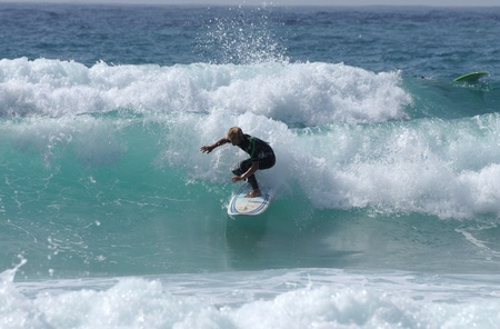 Surfer Rides a Large Wave. Canary Island Fuerteventura, Spain. Photo taken at 2nd of June 2009