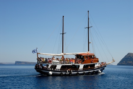 Traditional sailing boat with tourists in Santorini, Greece. Photo taken at 12th of June 2008のeditorial素材