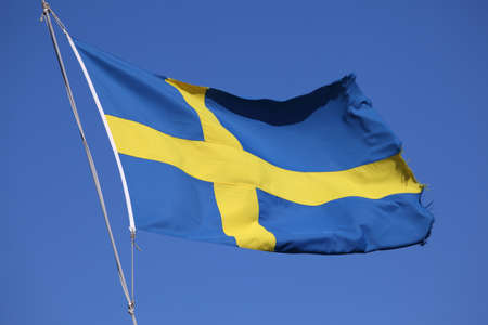 Flag of Sweden against blue skyの写真素材