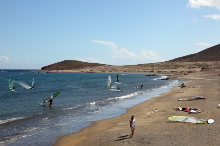 Surfers at the beach of El Medano, Canary Island Tenerife, Spain. Photo taken at 11th of March 2011のeditorial素材