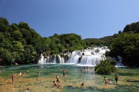 People bathing in front of the waterfall in Krka National Park, Croatia. Photo taken at 6th of July 2011のeditorial素材