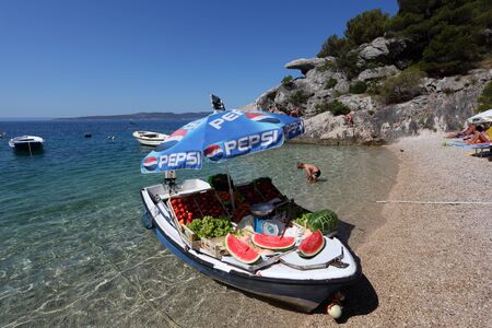 Fruits vendor boat at the Adriatic resort Brela, Croatia. Photo taken at 9th of July 2011のeditorial素材