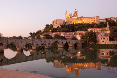 Cathedral and Pont Vieux at night. Beziers, southern Franceの写真素材
