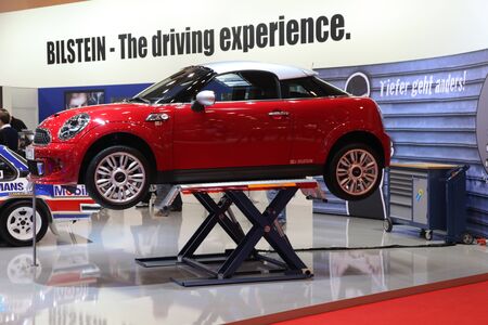 ESSEN - NOV 29: Mini Cooper on a car hoist shown at the Essen Motor Show in Essen, Germany, on November 29, 2011のeditorial素材