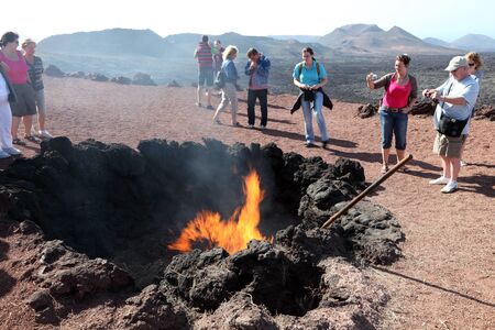 Tourists in Timanfaya National Park on Lanzarote, Canary Islands Spain. Photo taken at 16th December 2011のeditorial素材