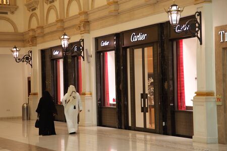 Arabic couple in Villaggio Mall Shopping Center in Doha, Qatar. Photo taken at 7th of January 2012のeditorial素材