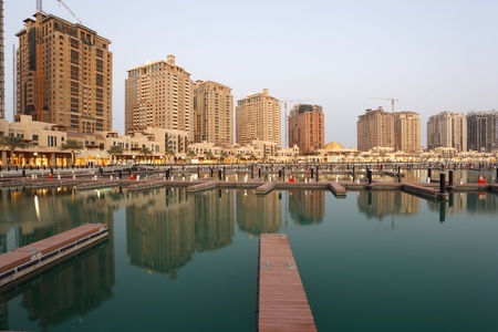 Residential buildings and empty Marina at The Pearl in Doha, Qatarの写真素材