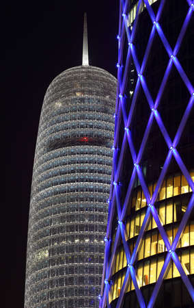 Burj Qatar and the blue illuminated QIPCO Tower in Doha, Qatar. Photo taken at 9th January 2012