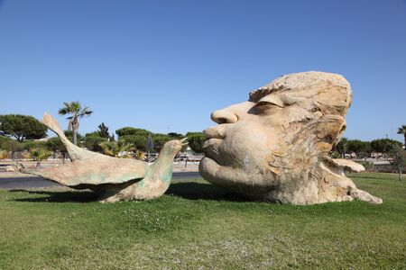 Man kissing a bird - sculpture in Matalascanas, Andalusia Spain. Photo taken at 7th of July 2012のeditorial素材
