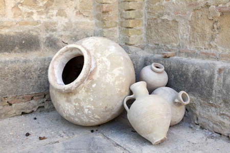 Old terracotta amphoras in a monastery courtyardの写真素材
