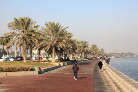 People walking on the corniche of Doha, Qatar. Photo taken at 6th of January 2012のeditorial素材