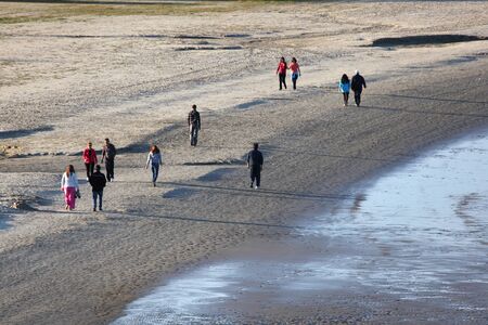 People walking on the beach in Algeciras, Spain