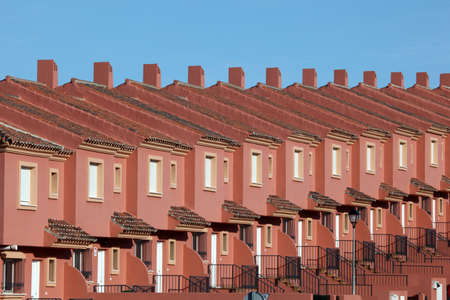 Row of red residential houses in a urbanization in Spainのeditorial素材