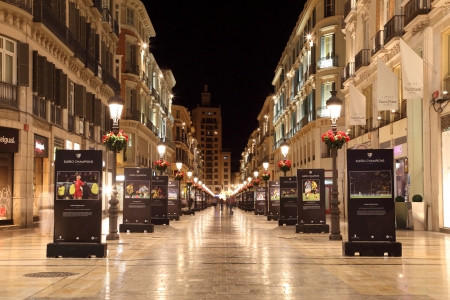 Street in the city of Malaga at night, Andalusia Spainのeditorial素材