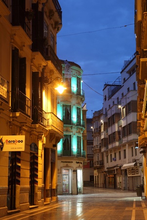 Street in the city of Malaga at night, Andalusia Spainのeditorial素材