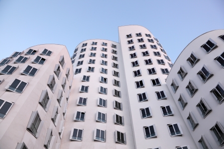 DUSSELDORF, GERMANY - SEPT 4: White buildings at the Neuer Zollhof, designed by the architect Frank O. Gehry and completed in 1998, in the Media Harbor in Dusseldorf, Germany on September 04, 2013のeditorial素材