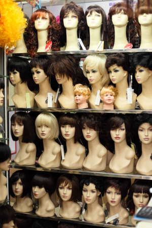 Female mannequins in peruke shop windowの写真素材