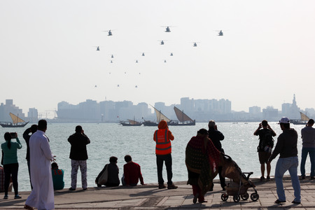 Spectators watching the Qatar National Day Air Show from the Corniche. December 18th 2013 in Doha, Qatar, Middle Eastのeditorial素材