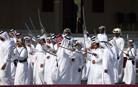 Traditional bedouin dance with sword at Qatar National Day in Doha. Qatar, Middle East