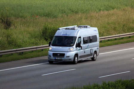 Small motor home on the highway in Germany のeditorial素材