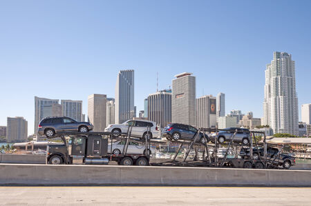 Truck on the bridge and Miami downtown. Florida, USA