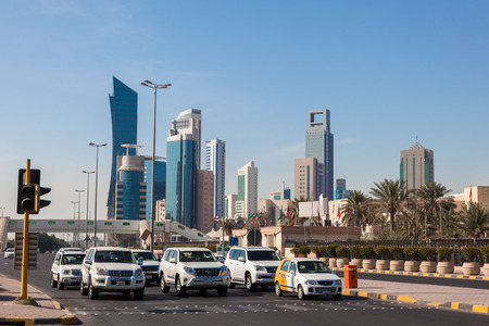 Cars waiting for green light on the street downtown in Kuwait City. December 8, 2014 in Kuwait, Middle Eastのeditorial素材