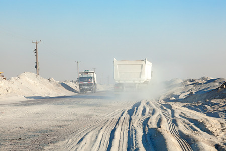KUWAIT - DEC 9: Trucks on a road in the desert of Kuwait. December 9, 2014 in Kuwait, Middle Eastのeditorial素材