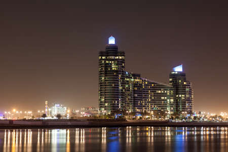 DUBAI, UAE - DEC 15: The Marsa Plaza Building illuminated at night. December 15, 2014 in Dubai Festival City, United Arab Emiratesのeditorial素材