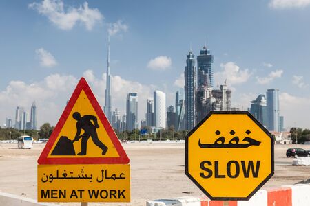 Men At Work sign in the city of Dubai, United Arab Emiratesの写真素材