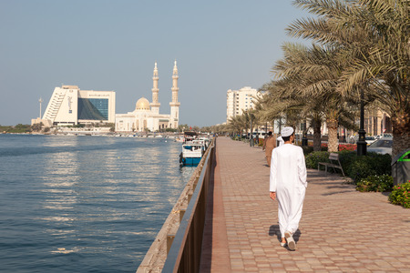 SHARJAH, UAE - DEC 20: Promenade at the Sharjah Creek. December 20, 2014 in Sharjah, United Arab Emiratesのeditorial素材