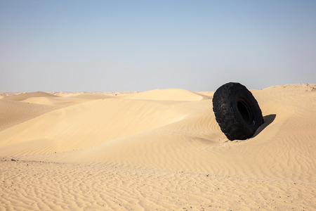 Tire off the desert highway in Abu Dhabi, United Arab Emiratesの写真素材