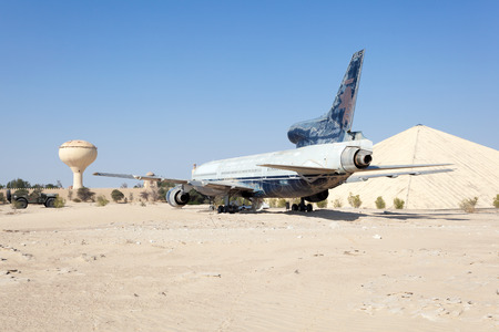 ABU DHABI - DEC 22: Airplane in the desert at the Emirates National Auto Museum in Abu Dhabi. December 22, 2014 in Abu Dhabi, UAEのeditorial素材