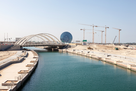 ABU DHABI - DEC 23: Al Muneera Canal with new bridges in Abu Dhabi. December 23, 2014 in Abu Dhabi, United Arab Emiratesのeditorial素材