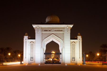 SHARJAH, UAE - DEC 17: University City of Sharjah Entrance Gate at night. December 17, 2014 in Sharjah, UAEのeditorial素材