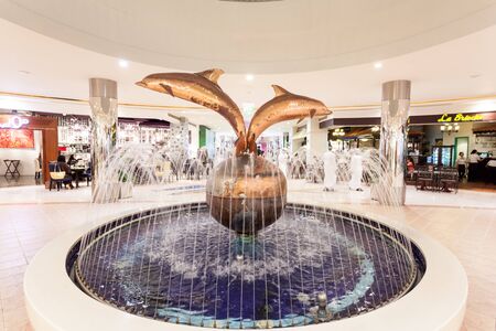 ABU DHABI - DEC 21: Dolphin fountain inside of the Marina Mall in Abu Dhabi. December 21, 2014 in Abu Dhabi, United Arab Emiratesのeditorial素材