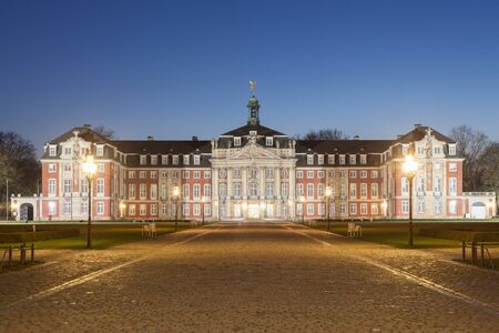 The Castle of Muenster illuminated at night. Munster, North Rhine-Westphalia, Germanyのeditorial素材