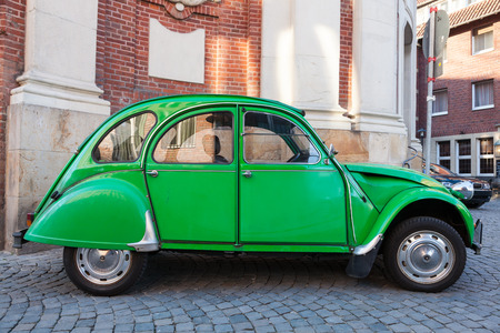 MUNSTER, GERMANY - APR 4: Old Citroen 2CV parked in the old city of Munster. April 4, 2015 in Munster, North Rhine-Westphalia, Germanyのeditorial素材