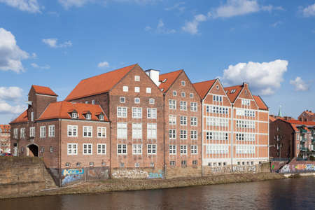 Historic brownstone waterfront buildings in Bremen, Germanyのeditorial素材