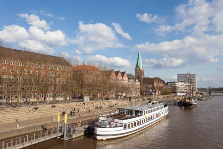 BREMEN, GERMANY - APR 5: Waterfront promenade at the Weser river in Bremen. April 5, 2015 in Bremen, Germanyのeditorial素材