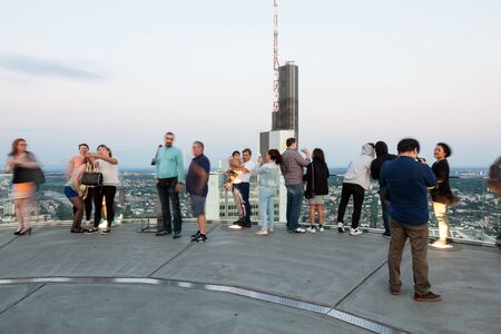 FRANKFURT MAIN - JUNE 27: Visitors at public viewing platform of the Main Tower skyscraper in the...