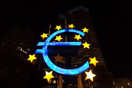 FRANKFURT MAIN - JUNE 27: Euro Sign near the old European Central Bank in the city of Frankfurt at night. June 27, 2015 in Frankfurt Main, Germanyのeditorial素材