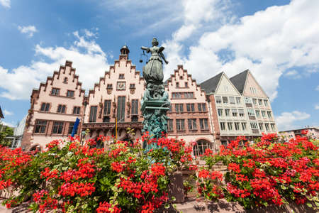 Lady Justice statue with fountain and flowers at the Roemberberg in Frankfurt Main, Germanyのeditorial素材