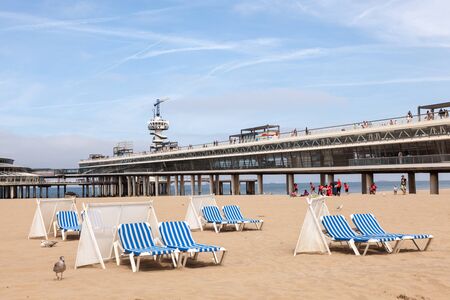SCHEVENINGEN, NETHERLANDS - AUG 10: Windscreens and sunloungers on the beautiful North Sea beach in Scheveningen. August 10, 2015 in Scheveningen, The Netherlandsのeditorial素材