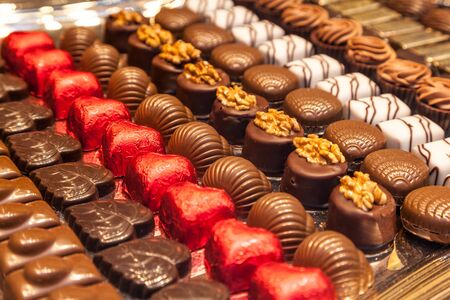 BRUSSELS, BELGIUM - AUG 22: Traditional belgian pralines in a shop window in Brussels. August 22, 2015 in Brussels, Belgiumのeditorial素材