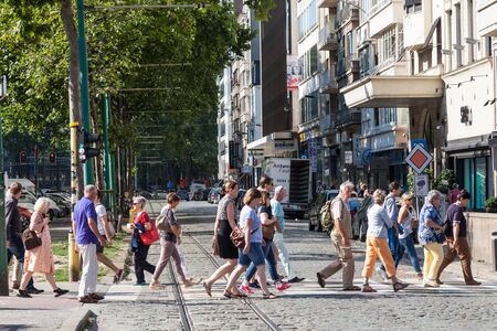 ANTWERP, BELGIUM - AUG 23: People crossing street in the city of Antwerp. August 23, 2015 in Antwerp, Belgiumのeditorial素材