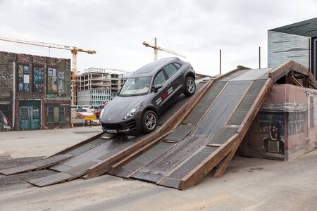 FRANKFURT, GERMANY - SEP 22: New Luxury Porsche Macan SUVs driving at an offroad parcours at the IAA International Motor Show 2015. September 22, 2015 in Frankfurt Main, Germanyのeditorial素材